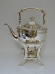Hot water 
kettle and 
burner. Silver 
(830). Made by 
Fritz 
Heimbürger  
(1898-1948). 
Produced 1908. 
...