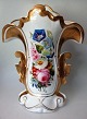 German 
porcelain vase 
o. 1900 with 
gilding and 
liveries of 
flowers. H .: 
31 cm. With 
production ...