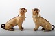 Meissen style, a pair of antique dog figurines, mops. 
