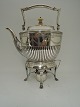 Hot water 
kettle and 
burner. Silver 
(830). Made by 
Michelsen, 
Copenhagen. 
Produced 1897. 
Height ...