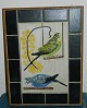 Wall relief in 
tiles with 
decorations of 
two budgerigars 
from Royal 
Copenhagen. 
Designed by ...