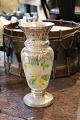 Old vase in 
mercury silver 
with fine 
patina and 
decorated with 
floral motif on 
the front.