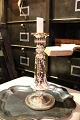 Antique French 
candlestick in 
mercery silver 
with fine 
patina. Height: 
26,5cm.