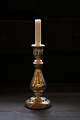 Old candlestick in mercury silver. Height: 24cm.