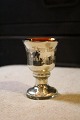 Fine little mug 
on foot in old 
Mercury silver 
with engraved 
text on the 
side. 
Height: 9cm.
