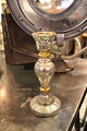 Old candlestick in mercury silver, decorated with little gold and has a worn patina. Height: ...