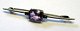 Tie pin in 
silver with 
amethyst, c. 
1920. L .: 5.8 
cm. No visible 
marks.