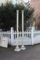 A pair of 
Antique French 
columns of wood 
with top 
decorated in 
stucco and base 
in granite. The 
...