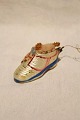 Old Christmas 
ornament for 
the Christmas 
tree in the 
form of painted 
glass shoes 
filled with ...