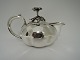 Teapot. 
Russian. Silver 
(84). Made in 
St. Petersburg. 
Silversmith 
C.A.S. Height 9 
cm.