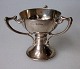 English salt in 
silver, 19th 
century. 
Cup-shaped with 
three handles. 
Stamped. H .: 
5.5 cm. Wt .: 
...