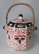 English biscuit 
bucket, 
earthenware, 
around 1920. 
Cream 
earthenware 
with overpaint 
in blue, red 
...