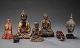 A collection of 
oriental 
figures in 
bronze and wood 
in form of 
Buddhas, foo 
dog etc.
China, ...
