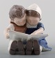 1567 Bing & 
Grondahl 
Porcelain 
Figurine
girl and boy 
reading.
Designed by 
Ingeborg 
Plockross ...