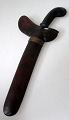 Indonesian kris, c. 1928. Flamed iron blade. Handle and case of wood. L .: 31 cm.Provenance. ...