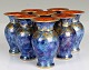 Rosenthal, 6 vases. Blue with golden insects and red interior.
