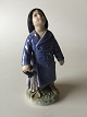 Royal 
Copenhagen 
Figurine Boy 
with Umbrella 
No. 3556. 
Measures 18,5 
cm and is in 
good condition.
