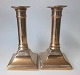 Pair Danish 
19th C. 
candlesticks in 
brass. Square 
foot, smooth 
strain. One 
collar with 
crack. H ...