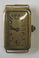 Ladies watch in 
golded box, 
1922. Deco 
form. Stamped 
in the box. 3 x 
1.6 cm. 
Enamelled dial 
with ...