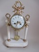 French pillar 
clock, 19th 
century. With 
ormelue. Marble 
plinth; two 
pillars and 
cirkurlar clock 
...