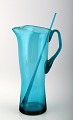 Orrefors Lemonade pitcher with stir stick in green blue glass.
