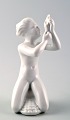 Harald Salomon 
for Rörstrand, 
white glazed 
figure of a sea 
child.
Hallmarked. In 
perfect ...