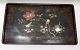 Japanese 
lacquer tray o. 
1910. Black 
painted with 
decorations in 
the form of 
flowers and 
birds. ...
