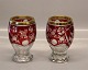 Bøhmisk Krystal 
røde vaser 
eller 
drikkeglas med 
guldkant og 
slebne 
jagtmotiver 
15.5 cm
Böhmisk, ...