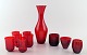 Lot of red art 
glass, 9 
drinking 
glasses, vodka, 
liqueur glasses 
and a decanter.
Monica Bratt 
...