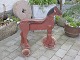 Wooden horse on 
wheels