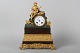 Antique Mental 
clock with 
playing man 
Bronze and 
partly gilded. 
Clock brand is 
Lenzkirch. H: 
...