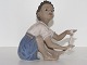 Dahl Jensen 
figurine, girl 
in blue dress 
selling pearls.
The factory 
mark tells, 
that this ...