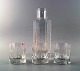 Iittala art 
glass service, 
3 glass and a 
carafe.
In good 
condition.
Carafe 23 cm.