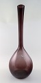 Reijmyre, 
colossal 
Swedish art 
glass vase in 
purple.
In very good 
condition. 
Measures 51 x 
18 cm.