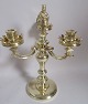 Candelabra of 
brass / bronze 
with 3 arms. 
Round base, 
baluster stem. 
Figure in the 
form of ...