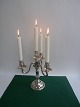 4-armed 
candlestick in 
silver, Denmark 
1937.
29cm. high and 
25cm. wide.