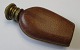 Perfume flacon. 
19/20. century. 
England. In 
clear glass. 
External with 
leather with 
gold print. ...