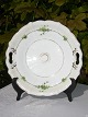 Bing & Gröndahl 
Porzellan. B&G  
Antikke 
Kuchenteller 
mit 
Blumenbemalung. 
Durchmesser 25 
cm. ...