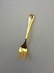Georg Jensen 
Annual Cake 
Fork 1986 in 
gilded Sterling 
Silver with 
enamel. 
Measures 13,5 
cm