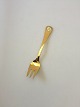 Georg Jensen 
Annual Cake 
Fork 1987 in 
gilded Sterling 
Silver with 
enamel. 
Measures 13,5 
cm (5 5/16")