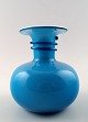 Per Lütken for 
Holmegaard 
Carnaby vase, 
blue and
white opal 
glass.
Measures 14 x 
14 cm.
In ...