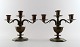 A pair of three-armed GAB (Guldsmedsaktiebolaget) Art Deco candlesticks in 
bronze.