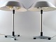 Jo Hammerborg. A pair of table lamps model President of polished steel, spacers 
and legs in black wood.
Produced by Fog & Morup.
