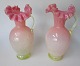 A pair of 
vases, app. 
1900. Jugend. 
Presumably 
Germany. In 
yellow and pink 
glass mass. 
With ...