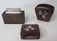 Cigarette set, 
1960s, Denmark. 
3 parts. In bog 
oak and silver. 
Stamped AS, 
sterling, 
Denmark. L: ...