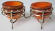 A pair of salts 
in glass, Art 
Deco, ca. 1930. 
Clear glass 
with orange 
overlay. With 
enamel ...