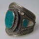 Afghan arm 
band, 20th 
century. 
Silver-plated 
metal. With 
decorations and 
malachite. H: 
10 cm. ...