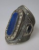 Afghanistan, 
arm jewelry, 
20th century. 
Silver plated 
metal with 
decorations and 
lapis lazuli. H 
...