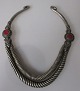 Afghan neck 
ring, 20th 
century. 
Silver-plated 
metal. With 
decorations and 
red stone. L .: 
20 cm. ...