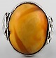 Silver ring with amber.
